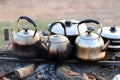 Tea pots on charcoal fire Royalty Free Stock Photo